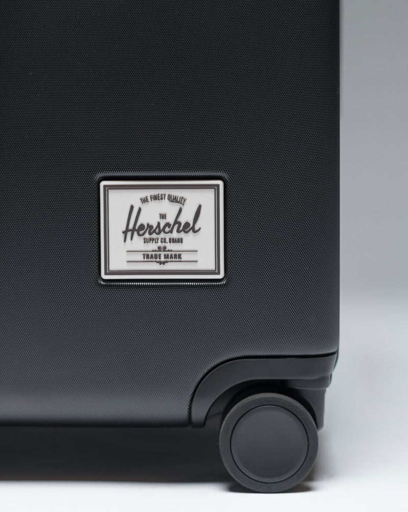 Herschel Heritage Hardshell Large Carry-On Luggage size guide chart showing dimensions, volume, and weight for all luggage sizes.