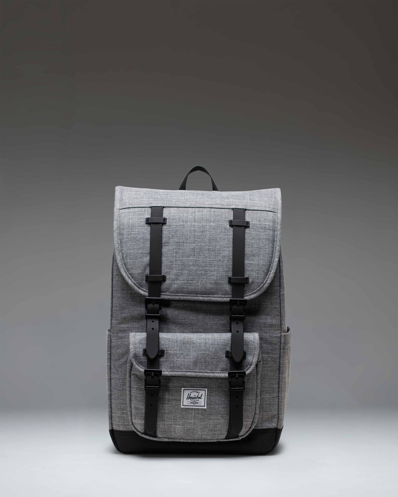 Herschel Little America Mid Backpack in Raven Crosshatch grey with black rubber straps and a classic woven label.