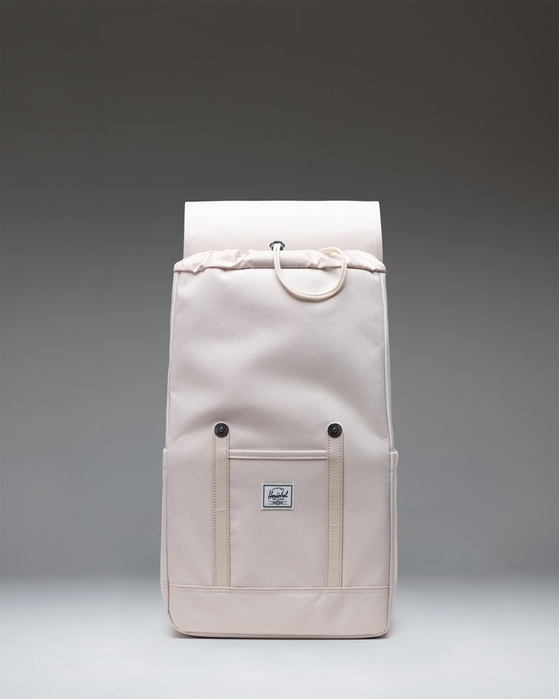 Herschel Retreat Backpack size guide chart showing dimensions for Standard (23L, 45.7x27.9x15.2cm) and Small (17L, 46x25.5x14cm).