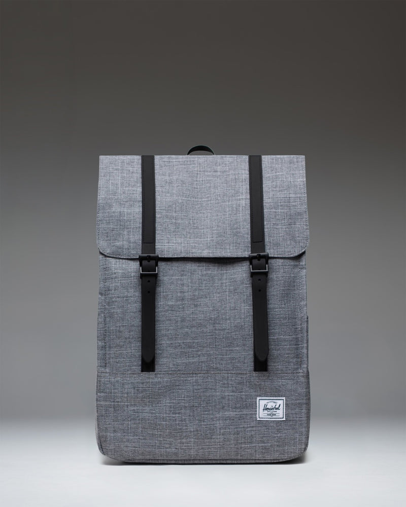 Herschel Survey Backpack in Raven Crosshatch gray with dual strap closures.