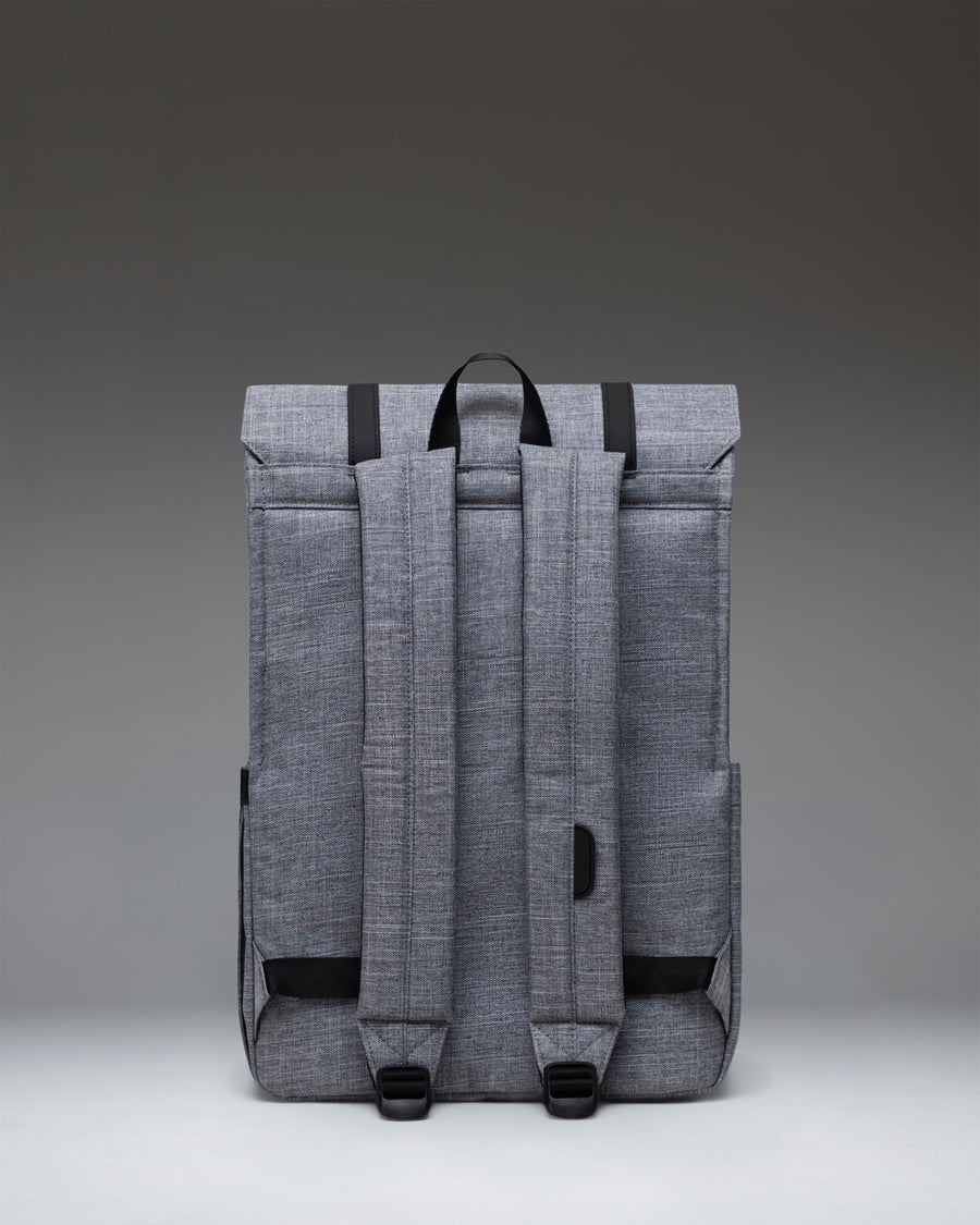 Herschel Survey Backpack in Raven Crosshatch grey, featuring a modern square design with dual magnetic strap closures.