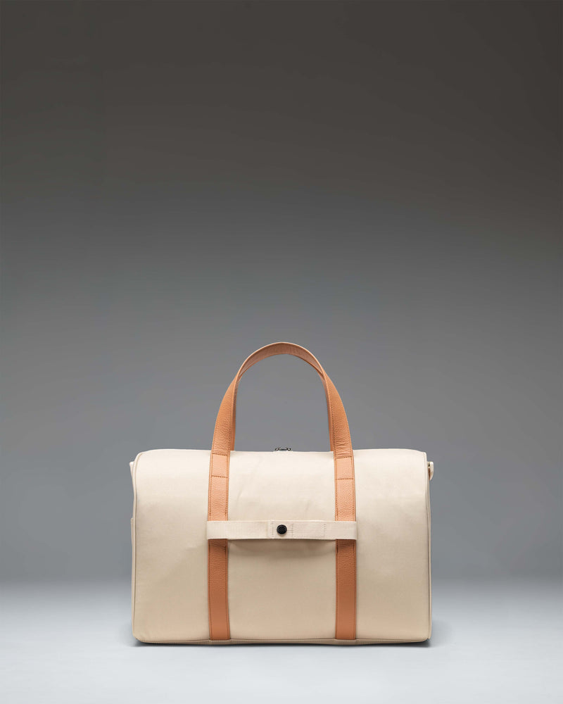 Herschel Novel Carry On Duffle in Eucalyptus green, featuring a side profile view of the classic duffle bag design with durable top handles.