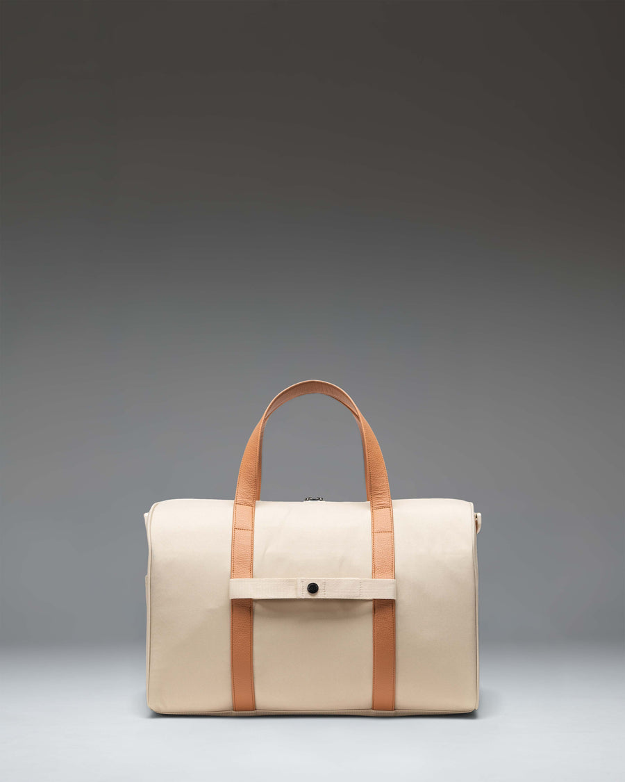 Herschel Novel Carry On Duffle in Eucalyptus green, featuring a side profile view of the classic duffle bag design with durable top handles.