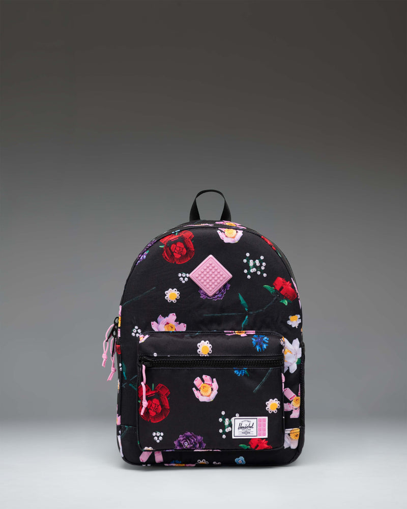 LEGO Herschel Heritage Kids Backpack in Falling Florals color, featuring a vibrant floral pattern with LEGO brick graphics.