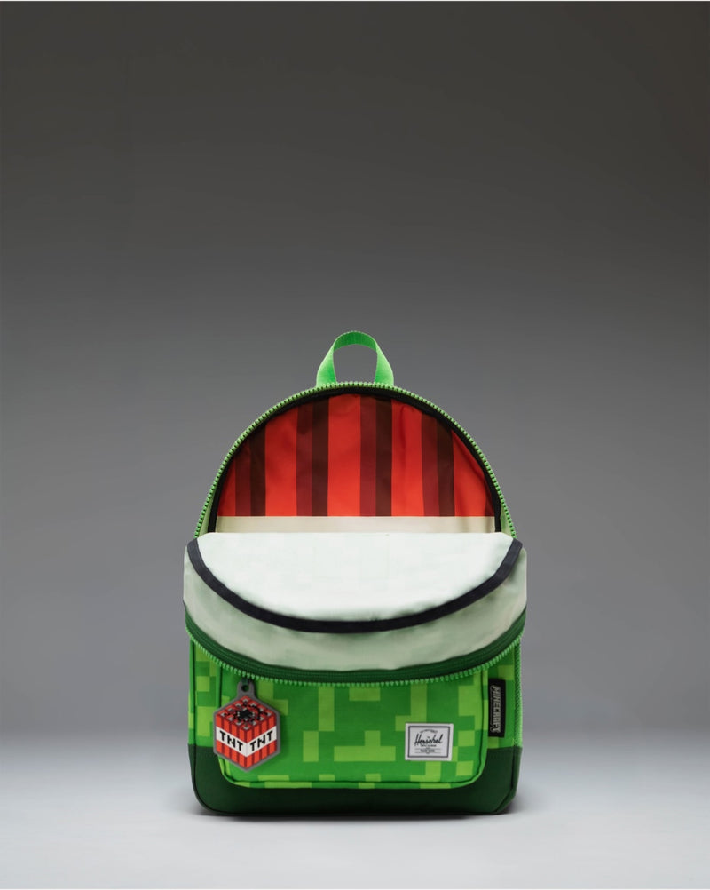 Herschel Supply Co. Minecraft Heritage Kids Backpack in the green and black pixelated Creeper pattern.
